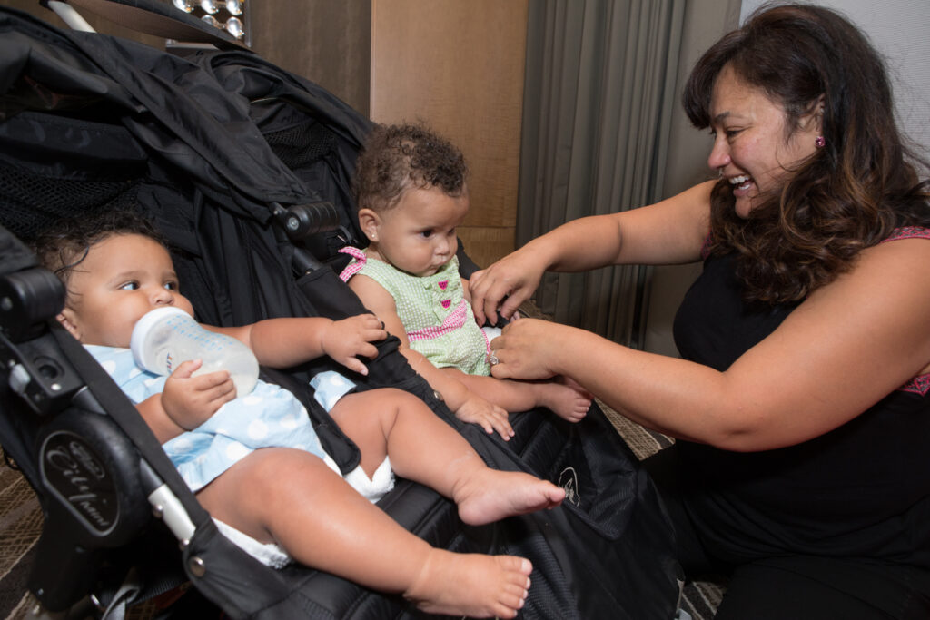 Female faculty with two babies in stroller